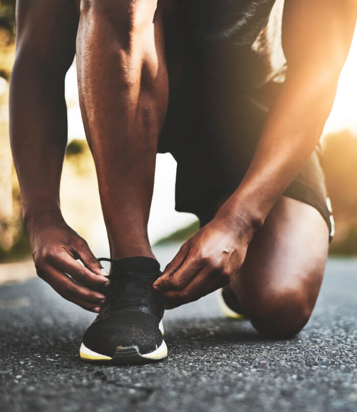 Person tying athletic shoes